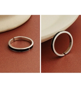 Macro detail of S925 sterling silver ring featuring black enamel and geometric patterns