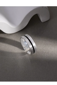Close-up of S925 sterling silver open ring with brushed texture and black enamel stripe