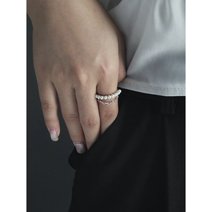 Minimalist S925 silver double-layer ring featuring a delicate pearl chain on female hand
