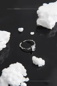 Detail view of a vintage S925 silver ring featuring a rectangular gemstone and dotted texture