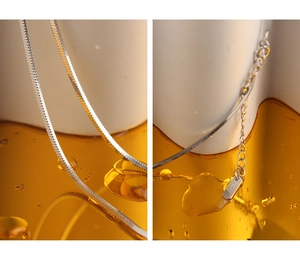 Detail of S925 sterling silver herringbone chain necklace showing flat snake chain links