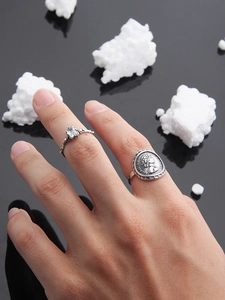 Macro detail of S925 silver coin ring with portrait relief and crystal gemstone ring