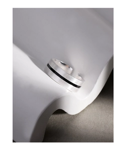Macro detail of minimalist S925 sterling silver ring with brushed finish and black enamel inlay