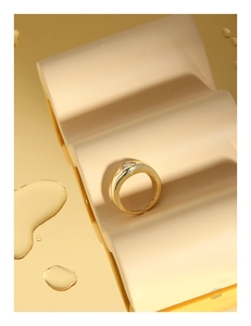 Macro shot of S925 sterling silver gold ring with a sparkling round zircon stone