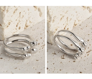 Close-up of S925 sterling silver open ring featuring artistic organic lines and hallmark