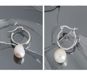 Detailed macro view showing the S925 hallmark on minimalist baroque pearl hoop earrings