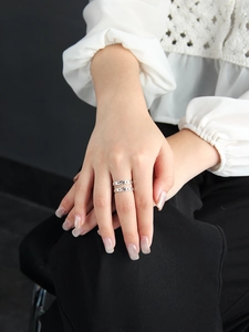 Close-up of minimalist S925 sterling silver U-shaped double chain ring on finger