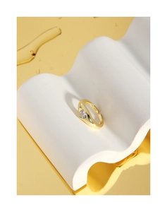 Macro shot of S925 sterling silver stamp on golden heart zircon open ring