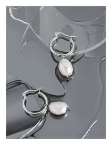 Detail of minimalist S925 sterling silver hoop earrings with baroque irregular pearls