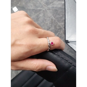Minimalist S925 silver ring with red heart-shaped gemstone pendant on twisted band