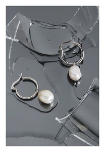 Detail of S925 sterling silver stamp on earrings with irregular baroque pearl charms
