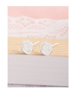 Macro detail of silver S925 smiling face stud earrings with a hollow-out mirror finish