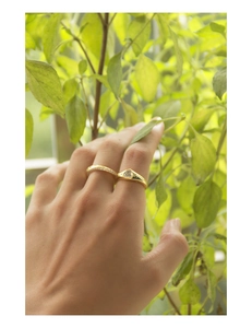 Close-up of gold S925 silver ring featuring a heart zircon and paved diamonds