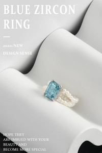 Detail of S925 silver ring featuring blue zircon and triple rows of natural pearls