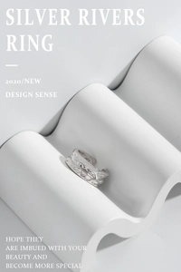 Detailed shot of irregular silver wave ring featuring sparkling zircon inlay on wavy stand
