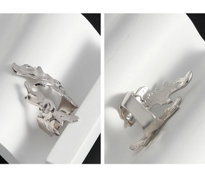Detailed macro view of S925 sterling silver ring with organic liquid metal texture