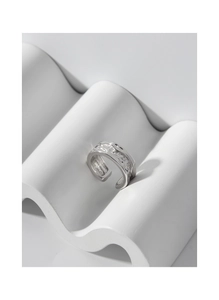 Macro detail of S925 sterling silver open ring with irregular lava liquid texture
