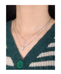 Detail view of double-layer S925 silver star necklace and round crystal pendant