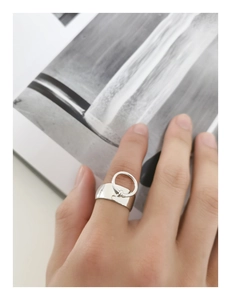 Minimalist S925 sterling silver wide band ring with circle pendant on a hand