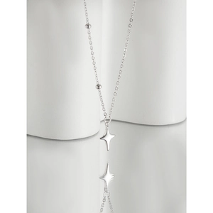 Minimalist S925 sterling silver star pendant necklace with beaded chain on white pedestal