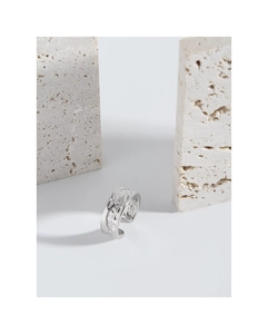 Macro shot of silver ring featuring irregular river texture and organic lava molten surface