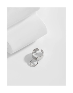 Detailed macro view of wide S925 sterling silver ring with a round hanging charm
