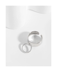 Detail of wide S925 sterling silver ring with small hanging hoop and polished finish