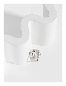 Detailed close-up of S925 sterling silver wide band ring with hallmark on white stand