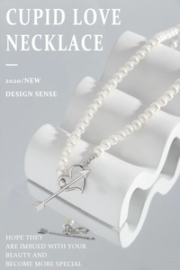 Detail of Cupid love heart arrow pendant on elegant white pearl necklace for women