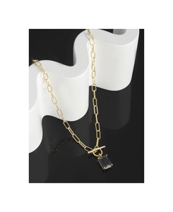 Detail of gold paperclip chain necklace with black rectangular pendant and crystal OT buckle