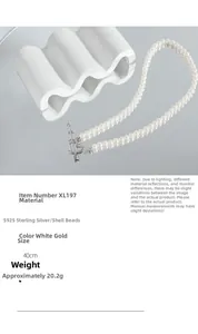 Macro view of S925 sterling silver heart arrow clasp on double-row pearl necklace