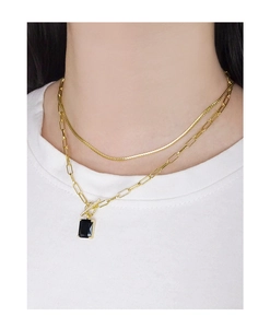 Detail of layered gold S925 silver necklace with black square gem and OT toggle clasp