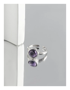 Detailed macro shot of S925 sterling silver ring with purple zircon and irregular texture