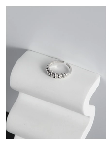 Close-up of S925 sterling silver stamp and twisted croissant texture on adjustable ring