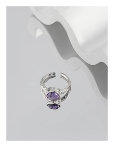Detailed view of S925 sterling silver ring with purple zircon and irregular texture