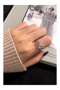 Detail of S925 sterling silver chain ring with toggle clasp worn on finger