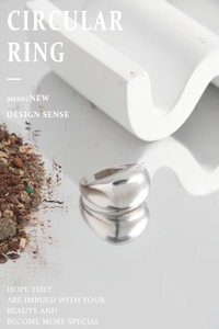 Macro shot of minimalist wide dome S925 sterling silver ring with polished finish