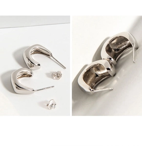 Detailed close-up of S925 sterling silver minimalist geometric rhombus stud earrings