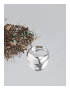 Close-up of S925 sterling silver wide band ring showing mirror finish and inner engraving