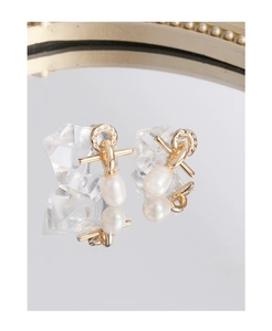 Detailed view of elegant pearl drop earrings with gold twisting and zircon accents
