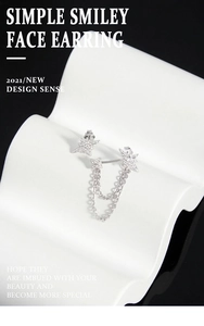 Detailed view of silver star earrings with crystal tassels and micro-set cubic zirconia