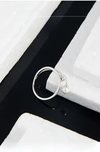 Macro shot of S925 sterling silver ring showing the S925 hallmark and pearl detail