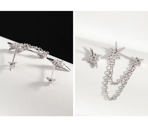 Macro detail of asymmetric S925 sterling silver star earrings with chain connection