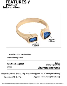 Macro detail of S925 silver ring featuring blue geometric zircon and champagne gold finish
