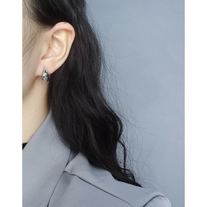 S925 sterling silver geometric water drop earrings for women worn by a model in casual style