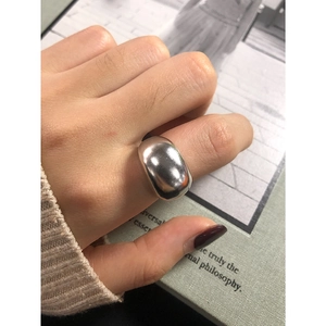 Minimalist wide S925 sterling silver ring with polished finish worn on finger