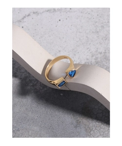 Macro detail of S925 sterling silver ring with blue geometric stones on stone display