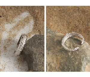 Detail of S925 silver adjustable ring featuring a textured lava surface and heart shape