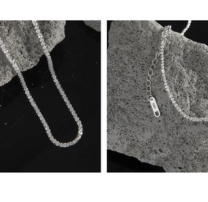 Macro detail of S925 sterling silver chain with lobster clasp and sparkling texture