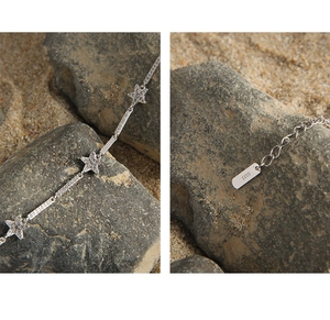 Macro shot of S925 sterling silver star bracelet with cubic zirconia and S925 hallmark